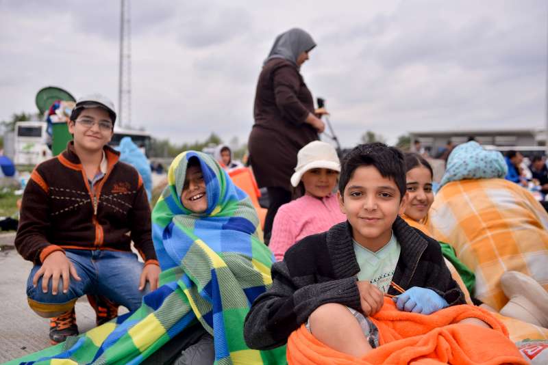 Seated, from left to right, Faiz, 13, Nour Aldin, 9, Hind, 10, Abderrahmane, 10, and Shahid, 9, arrived in Austria after travelling for 25 days through Turkey, Greece, fYR Macedonia, Serbia and Hungary. They fled with their family from Damascus, Syria.  