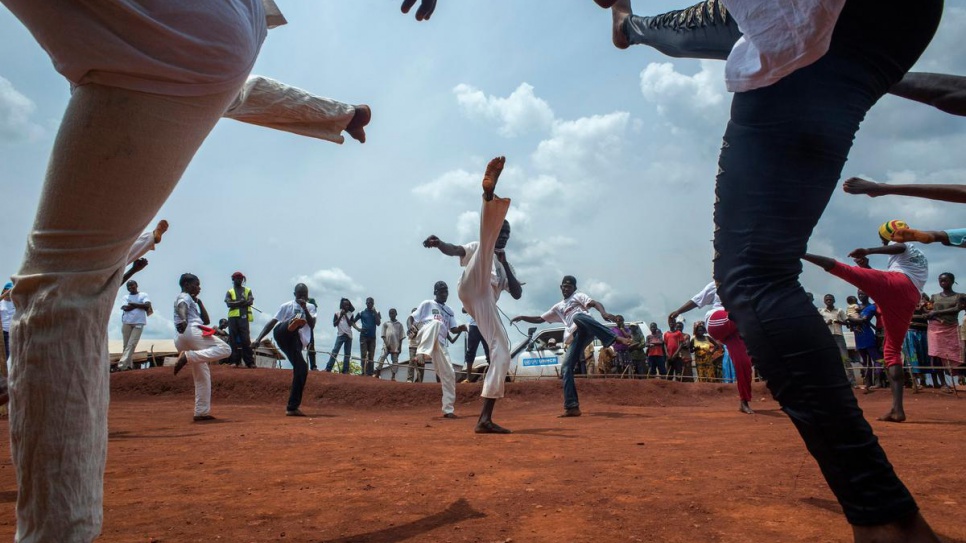 Central African refugees practice capoiera before an audience at Mole camp in Equateur Province, DRC, on 21 August, 2014.