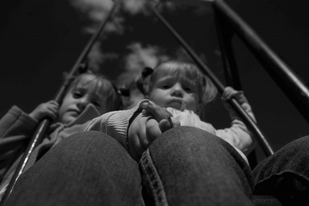 Two Syrian children on a makeshift swing in the Reception Centre, at the village of Pastrogor, May 7, 2014  Photo: Dobrin Kashavelov