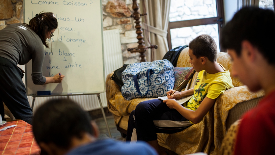 Young boys from Syria take part in a French language class.