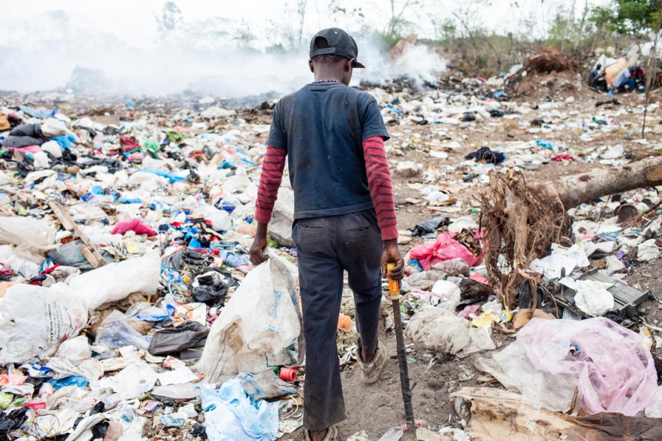 Joe Hullman, 13, works at San Pedro de Macoris municipal dump during his summer vacation, looking for metal scraps.