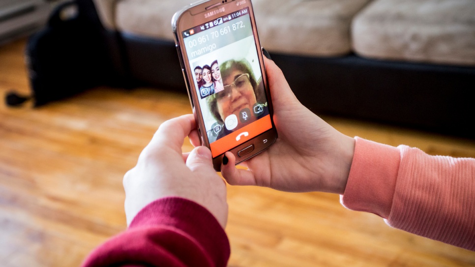 Now resettled in Canada, Syrian refugee Kevork Eleyjian and his sisters chat with their mother in Beirut, Lebanon, through Skype in this March 2016 photo.