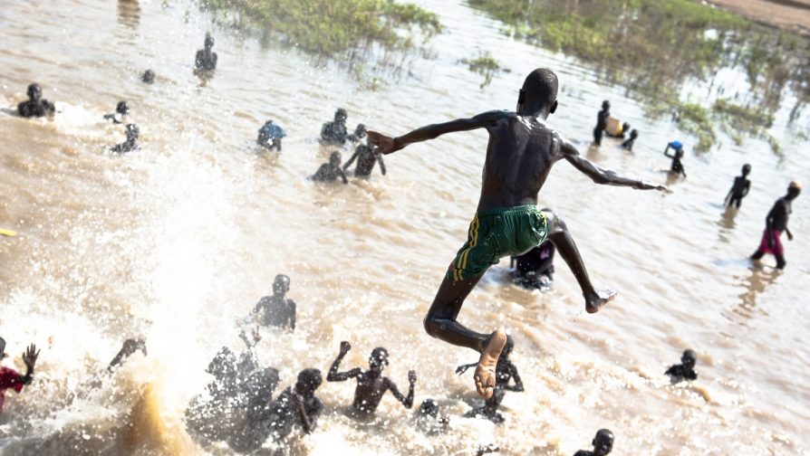 Ethiopia / South Sudanese Refugees / South Sudanese refugees play in the floods of Matar in the Gambella Region of Ethiopia, near the border of South Sudan, on 16 November 2014. UNHCR / Catianne T./ November 2014