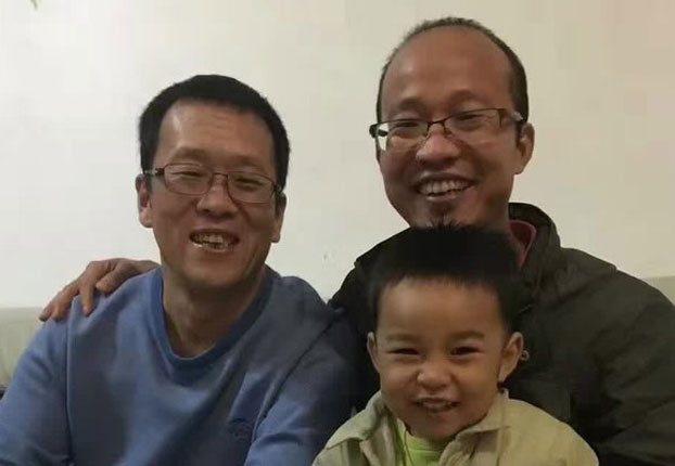 Wang Qingying (R) is shown following his release from prison.
