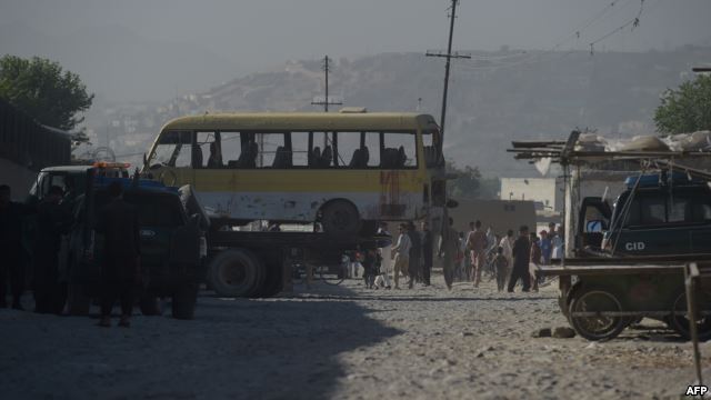 The minibus being taken away following the suicide attack in Kabul.