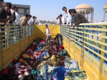 Iraq - Iraqis inspect the bodies of victims who were killed in the Tal Afar attacks conducted by unknown gunmen two days ago in Mosul, 29Mar2007