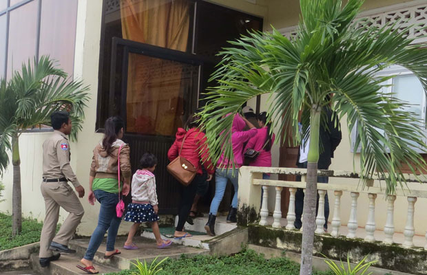 A group of 14 Montagnards enter an immigration police station in Ratanakiri province, July 31, 2015