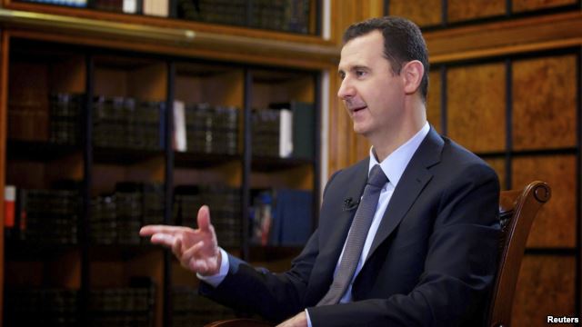 Syrian President Bashar al-Assad speaks during an interview with Russian state television in Damascus on September 12.
