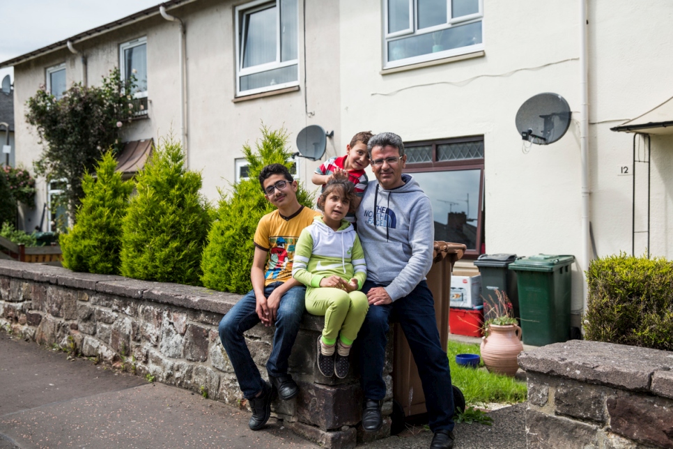 Mohammad Murad (left), 12, pictured with his sister Aisha, 10, brother Oweis, 4, and father Mohammed, 38, at their new home in Edinburgh. He is originally from Hasaka in Syria, but was living in Damascus with his family when the war began in 2011. His family fled in March 2013 to Domis Camp in northern Iraq where they stayed for three years before eventually being resettled in Scotland in April 2016.