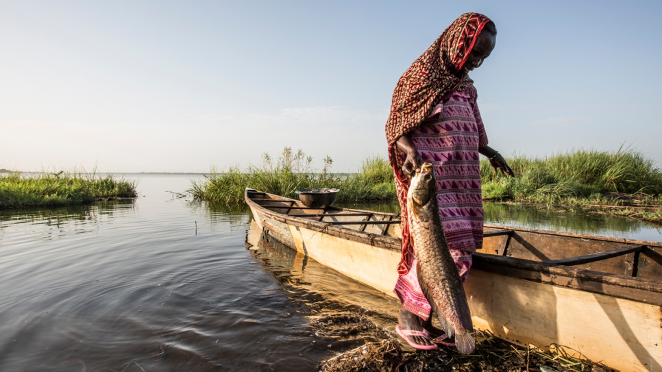 A local Chadian villager finishes washing her last big catch of the day.