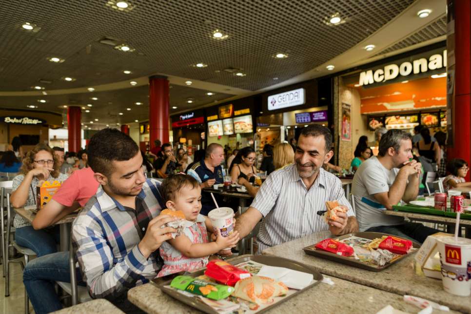 Khaled and his children enjoy a day out at a shopping mall in the Tatuape neighborhood of São Paulo, Brazil.