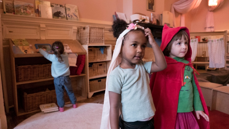 Two-year old baby Dina plays with her friends at nursery in Antwerp, Belgium. 