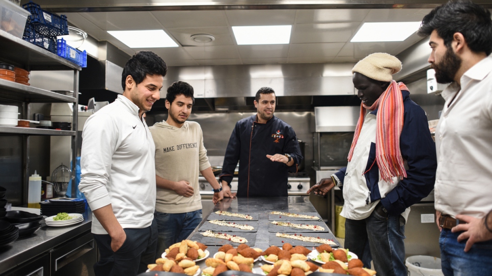 Rami Anis and Yiech Pur Biel have dinner at refugee chef Mohammed el-Khaldy's restaurant.