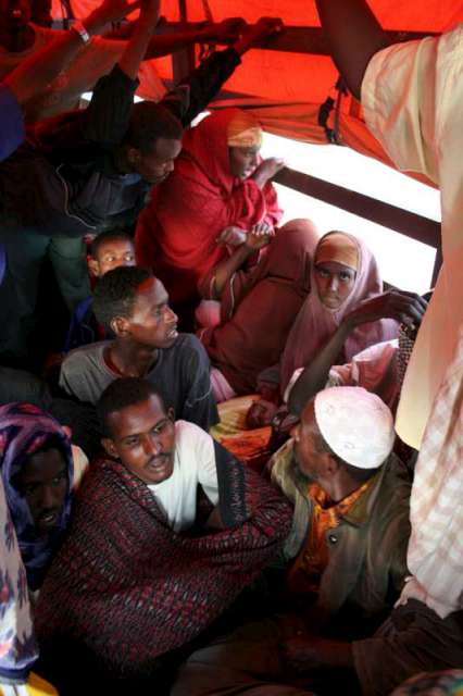 Packed into a truck, new arrivals leave the Mayfa'a reception centre for UNHCR's Kharaz refugee camp.