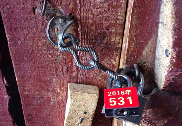 The locked door of a Larung Gar dwelling is shown in an undated photo.