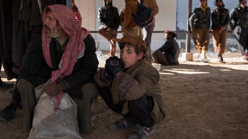 Some male members of families who fled their homes in and around Hawiga arrive at Kurdish security forces reception area near the Makhtab Khalid front line area South of Kirkuk city.