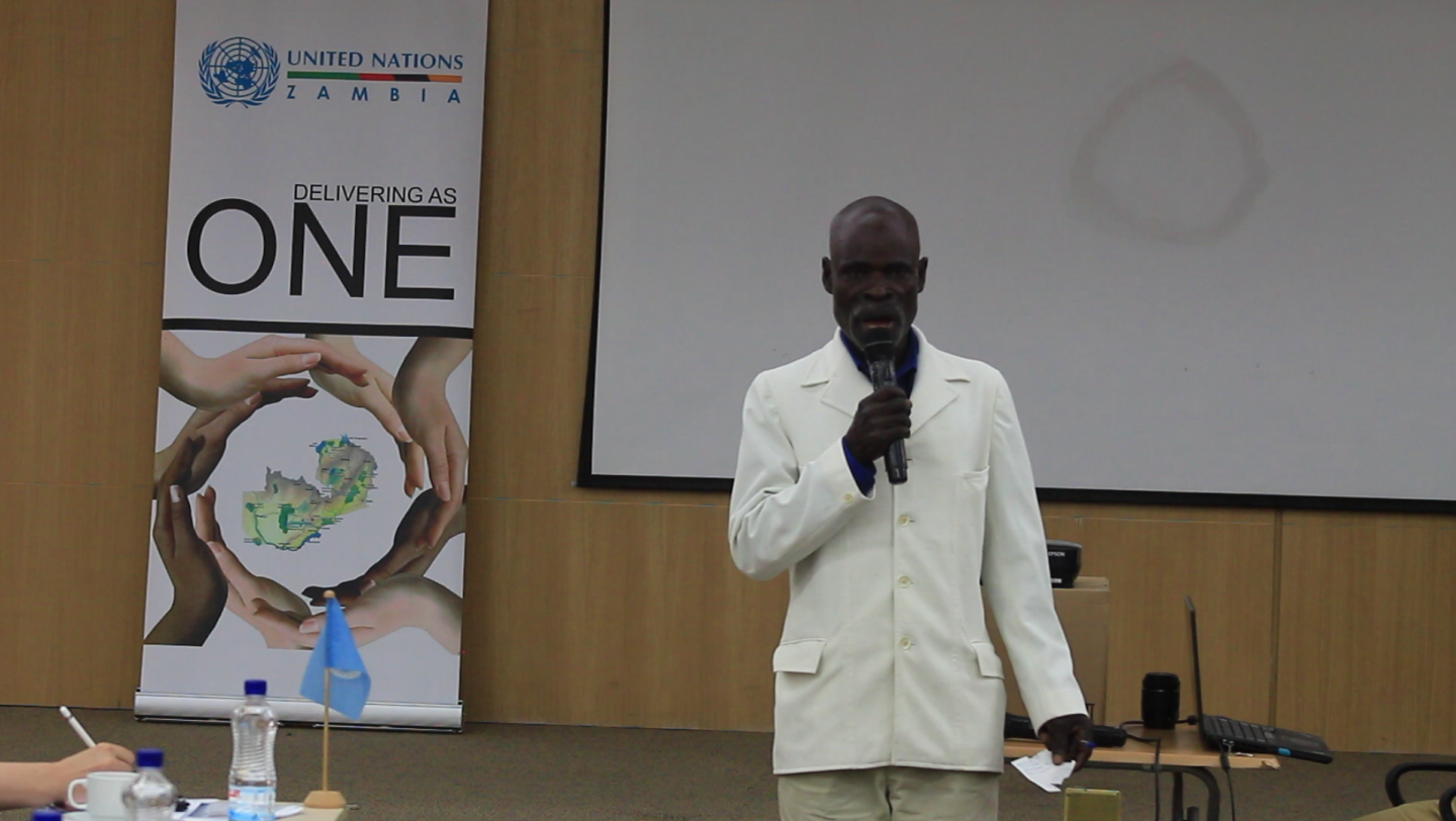 Former Angolan refugee, Noah Kaholo, speaks to donors and members of the National Advisory Group during the handover ceremony from humanitarian to development actors in Lusaka on 13 December 2016.