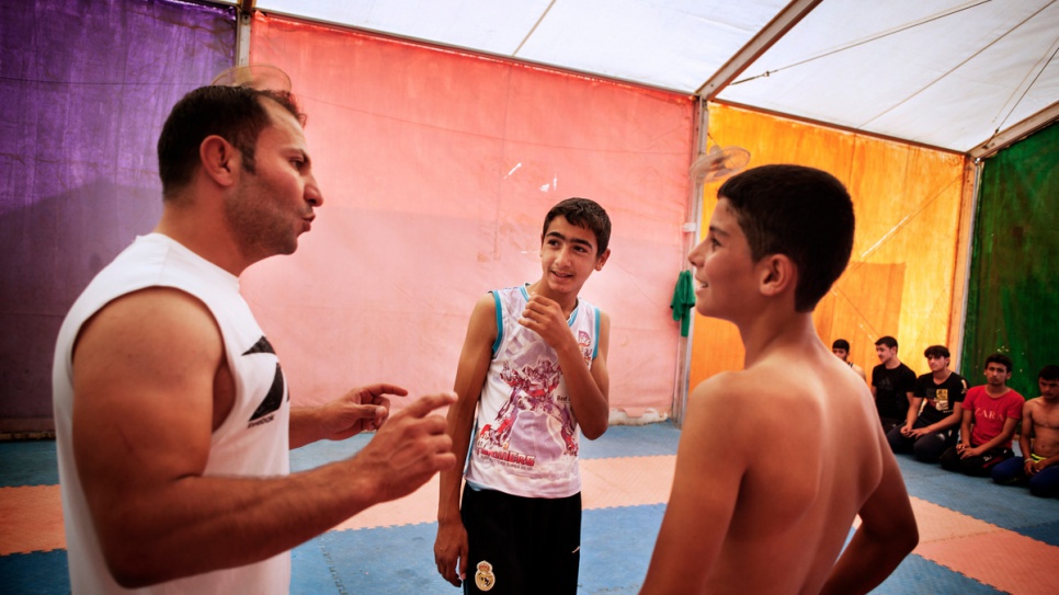 Mohammad Lakash (centre) says wrestling allows him to get his frustrations out while doing something he enjoys. "It taught me not to be aggressive and to be good to other people," he explains.