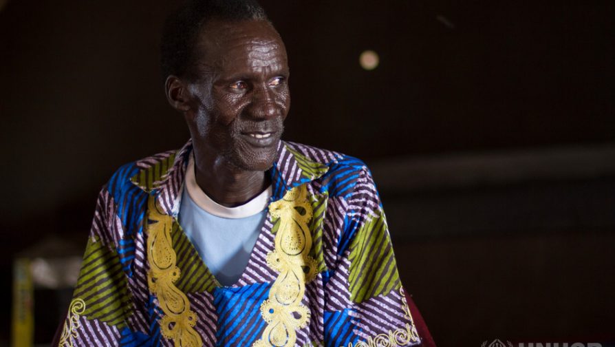 Peter Puot, 45 year old South Sudanese from Jonglei State, sat for KCPE in the year 2016. He poses for a photo during our interview. ; He fled his country due to war with his family. He enrolled his childrenin school while in Kakuma and later decided to enroll himself in the same class with his first born son.