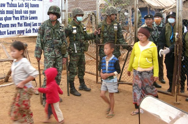 Thai soldiers stand guard during an operation to deport thousands of Hmong to Laos from a refugee camp in Huay Nam Khao in a file photo.