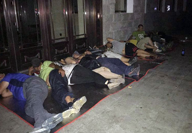 Ethnic Mongolian herders sleep outside government offices in Inner Mongolia's Shin-Barag Left Banner, August 2016.