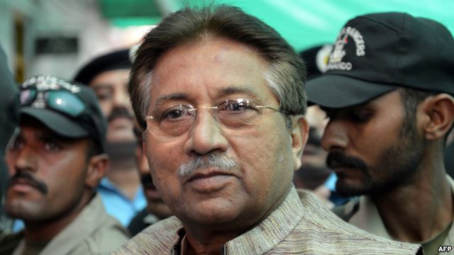 Former President Pervez Musharraf is escorted by soldiers as he arrives at an antiterrorism court in Islamabad in April.