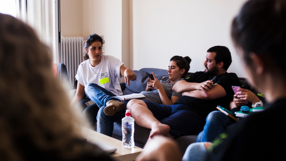 Sarah talks with other volunteers at the search and rescue organisation.