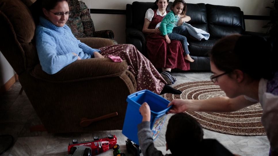 Members of the Hutterite group sponsoring the Al Hamoud family gather at Wanda Waldner's house.