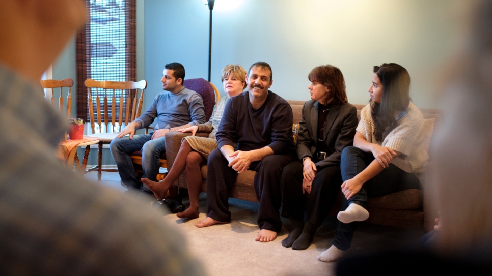 Hussein Arafat relaxes with the family's sponsors and new friends at their home.