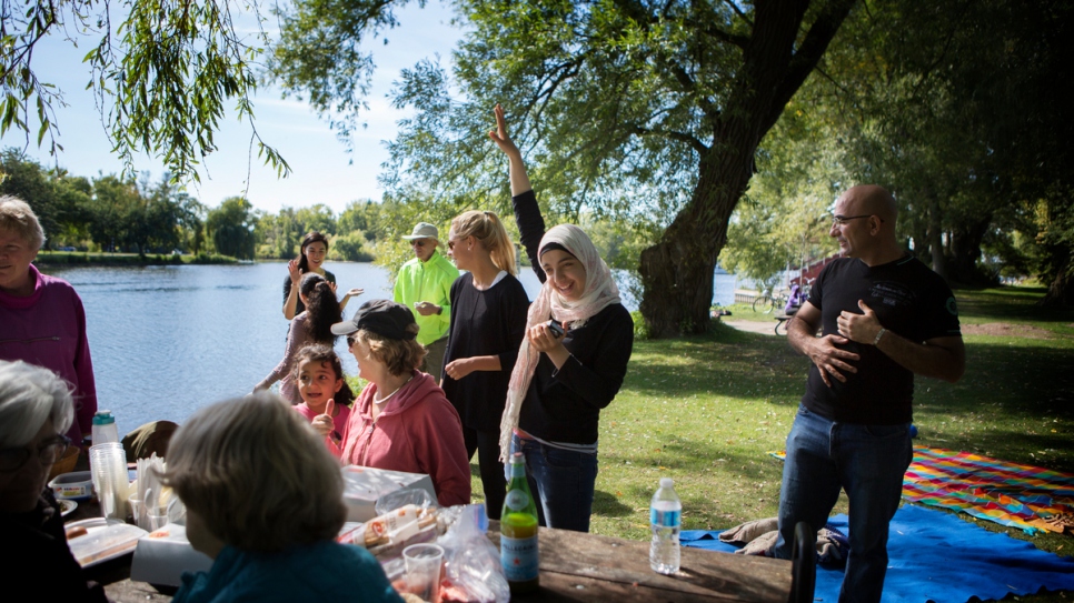 Canadians who are sponsoring the Nouman family organize activities like this picnic for the recently-arrived Syrian family.