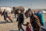 Iraqi families displaced from Mosul arrive at UNHCR's Hasansham camp i...