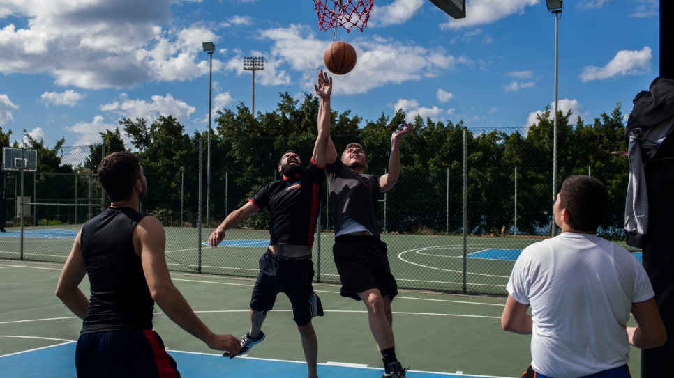 Syrian student Jankidar (second from left), plays basketball with friends at Lebanese University in Beirut. 