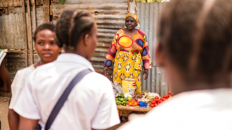 Rehema Kankindi, a Burundian refugee, sells vegetables on a street stall in Uvira, Democratic Republic of the Congo.  She fled across the border in 2015 after her stepson and two of her sons were killed in Burundi. 
