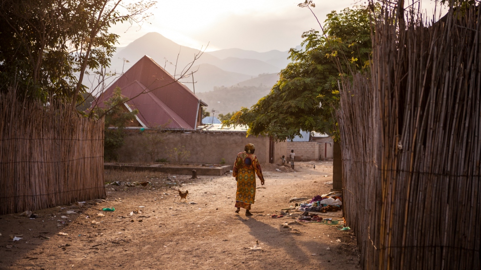 Rehema Kankindi walks through the streets of her new home, the city of Uvira. 