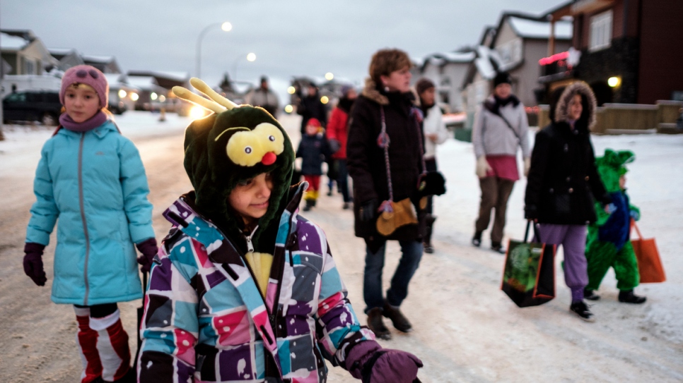 The Arafat children trick or treat with neighbourhood children for the first time.