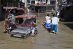 Typhoon Santi left streets in Binan City, 30 kilometres south of Manila, all but impassable in November 2009. UNHCR sent a small emergency team to help the displaced in the Philippines.