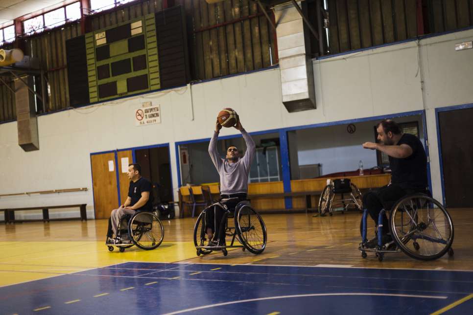 Ibrahim prepares to shoot during a basketball training session in Athens.