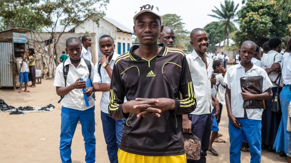 Swedi stands with his former classmates in Uvira. He fled Burundi with his mother after two of his brothers were killed. Because of financial hardship, he cannot afford to go to school anymore and has to work instead. "When I see the children going to school I feel bad," he says. "My heart aches."