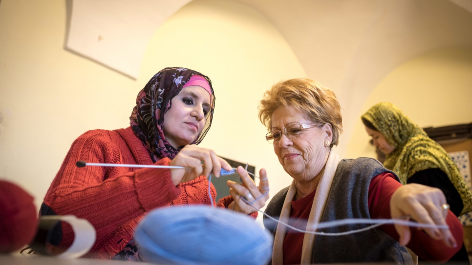 At a former monastery in the village of Forchtenstein, Afghan and Austrian women knit together.