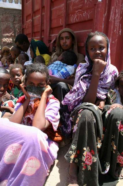 A group of women wait outside the Djibouti Refugee Agency office to register as asylum seekers. The wait could take days. Once registered, they are transferred to Ali Adeh, where UNHCR provides assistance.