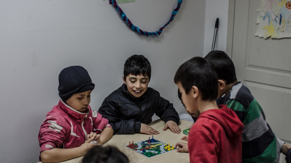 Afghan refugee children play in a kindergarten in a government shelter.