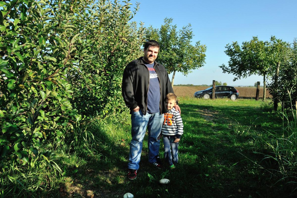 Miodrag, photographed with his five-year-old son, was forced from his own home by conflict in 1991 when he was 10 years old.