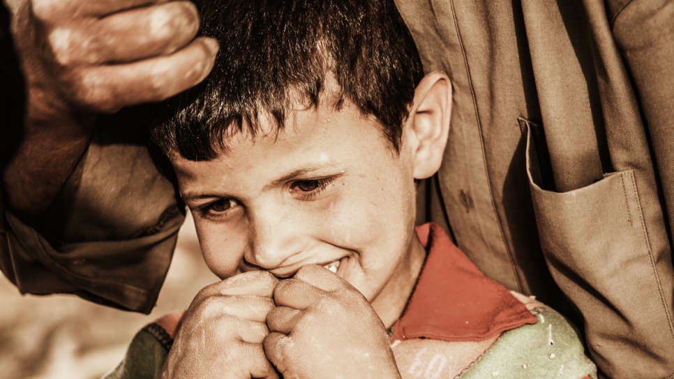 Ahmed's image here shows a child crying in Iraq. He says it symbolizes his own feeling. 