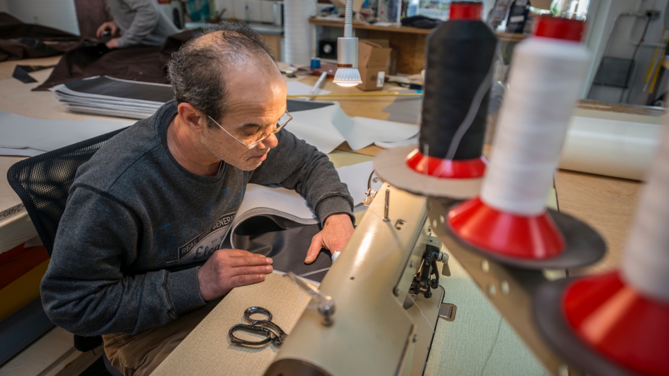 "I worked so hard in Damascus, and then the war came," says Mohammed, 51. He now works with his son Yousef at the sailmaking company Coastworxx near Kiel, Germany.