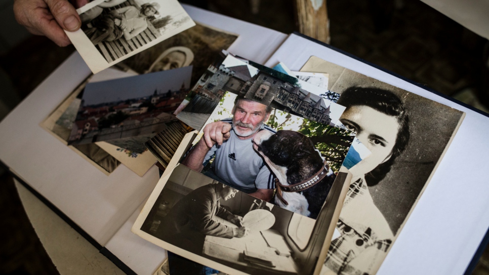 Photographs and memories belonging to Hanna cover the apartment she shares with her sick husband. The couple has faced social, financial and medical difficulties since the war began in eastern Ukraine.