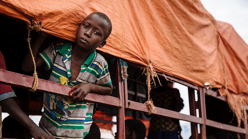 A South Sudanese refugee looks out of a truck before being transported to the recently established Imvepi settlement, at the Imvepi Reception Centre, Arua District, Northern Region, Uganda.