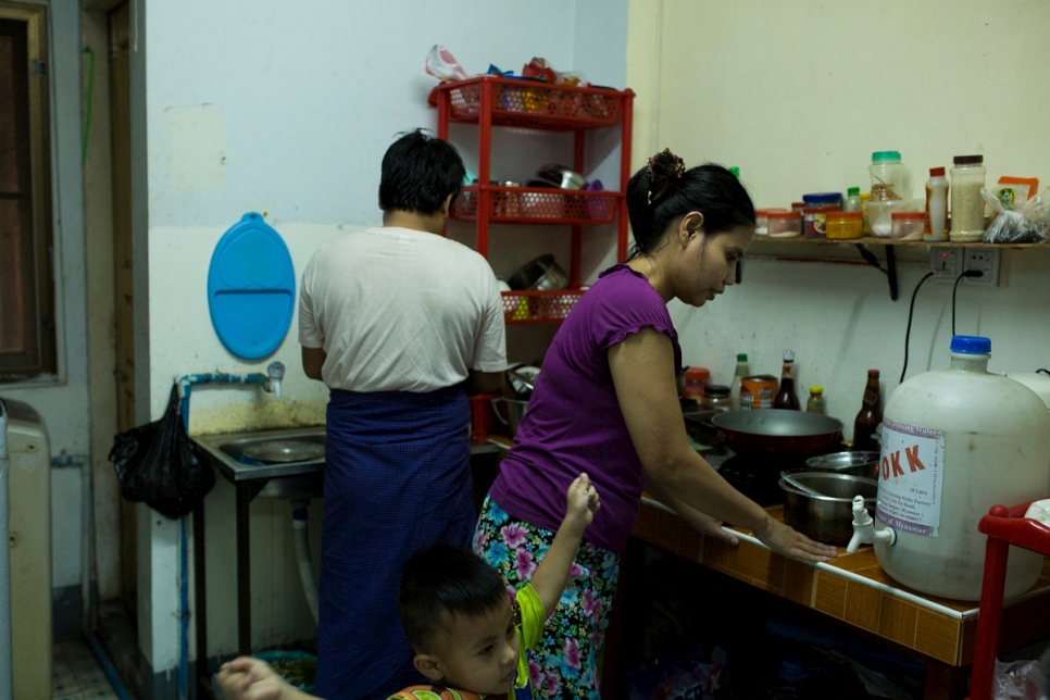 Thant and his wife, Ta Pyi Soe, 35, prepare dinner for their young sons in Myanmar.