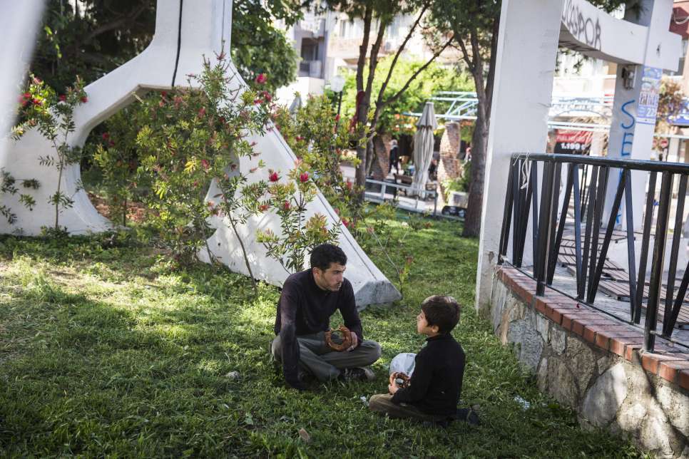 Firas and Uday take a break in the middle of their recycling route.