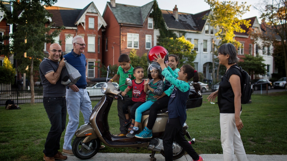 Having fun with the Nouman children is just one way Michael Adams and Thuy Nguyen help the family adjust to life in Canada.