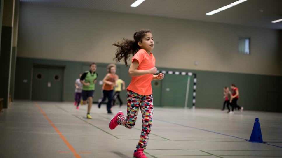 Kamala takes part in a sports lesson at her new school. 